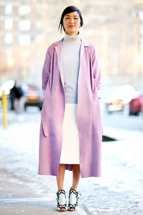 Lavender coat layered over a colorblocked knit and turtleneck.