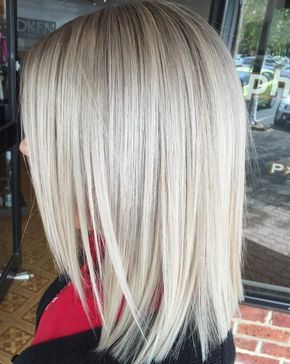 Blonde Layered Lob Layered front, shoulder length lob *straight cut back with the side sections angled sharply.